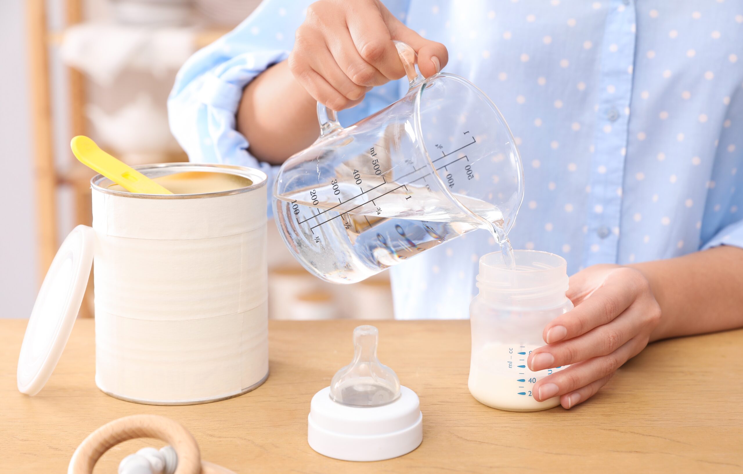 Woman,Preparing,Infant,Formula,At,Table,Indoors,,Closeup.,Baby,Milk baby formula